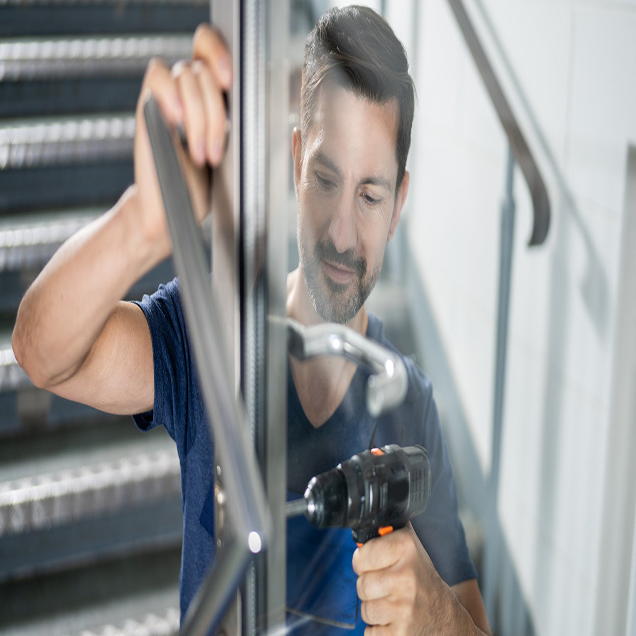 Technicain Fixes commercial door