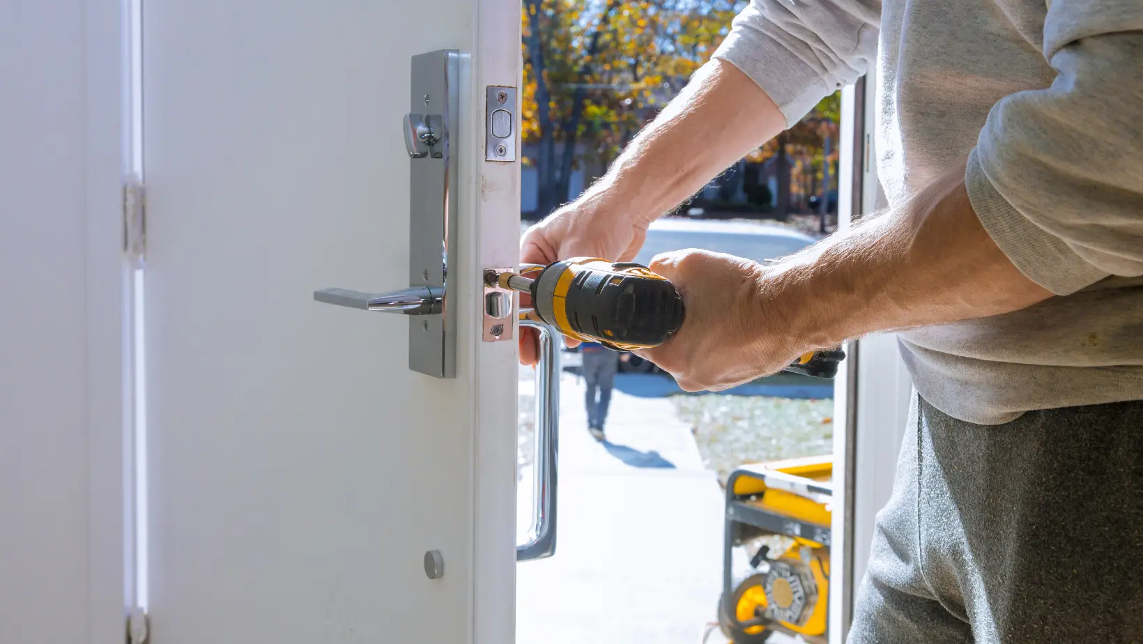 techncian fixes residential door lock
